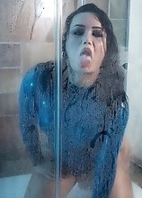 Bianka in sexy tight blue latex gets hard and horny on the shower